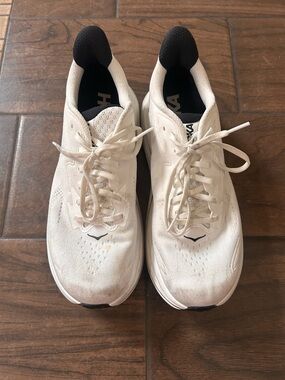 Hoka One One White Running Shoe with Black Interior and Blue Logo